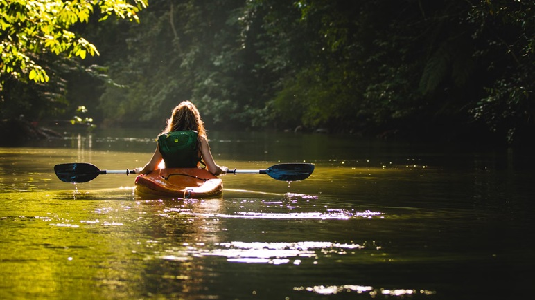 Young people kayaking on the loch